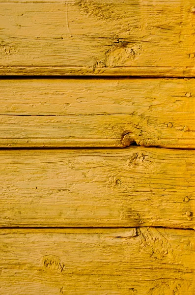 Fondo de tablas amarillas viejas y pintadas — Foto de Stock