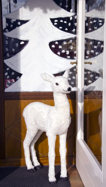 Christmas hind in the cafe door — Stock Photo, Image