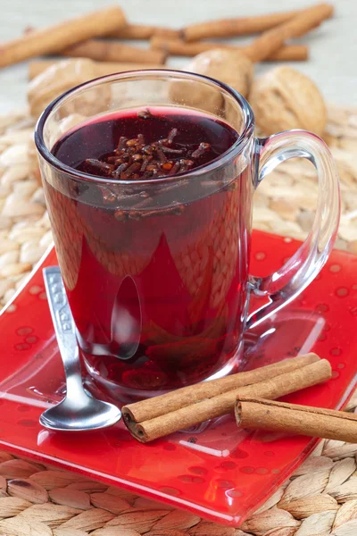 Glass of mulled wine with spoon and cinnamon — Stock Photo, Image