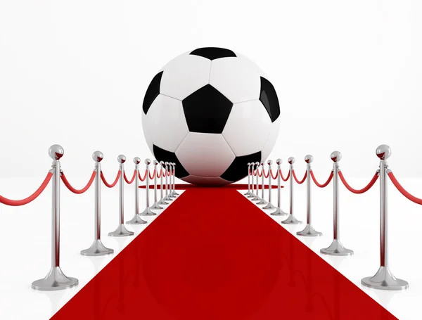 Pelota de fútbol en la alfombra roja — Foto de Stock