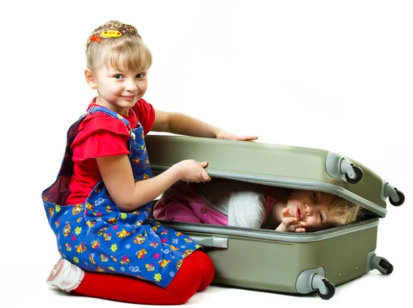 Little sisters and a suitcase — Stock Photo, Image