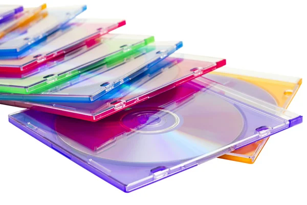 Färgglada DVD-skivor i lådor staplas i en hög — Stockfoto