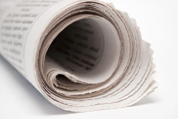 Several newspapers are rolled into a tube — Stock Photo, Image