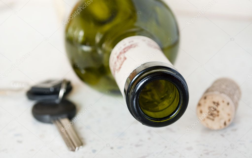 Bottle of wine and cork keys on the table