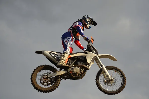 The spectacular jump motocross racer on a motorcycle — Stock Photo, Image