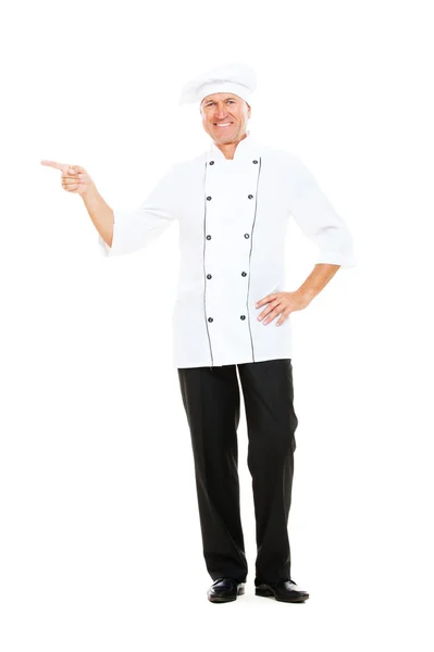 Smiley senior chef indicando qualcosa — Foto Stock