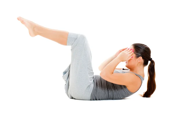 Kvinna göra övningar för magmusklerna — Stockfoto
