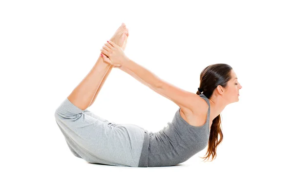 Donna che fa esercizio di stretching in abiti grigi — Foto Stock