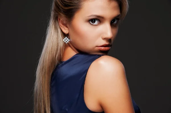 Beautiful blonde over dark background — Stock Photo, Image