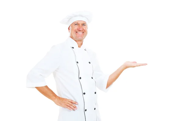 Веселый шеф-повар держит что-то — стоковое фото