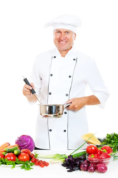 Chef in uniform holding pot and spoon — Stock Photo, Image