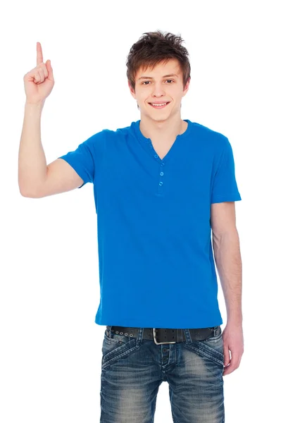 Trevlig kille i blå t-shirt pekar uppåt — Stockfoto