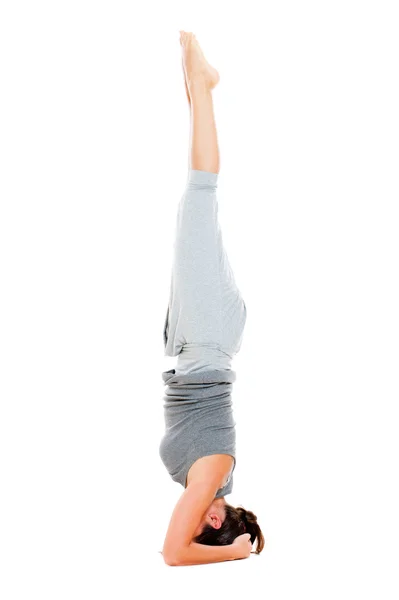 Dziewczyna robi ćwiczenia jogi, na piętrze — Zdjęcie stockowe