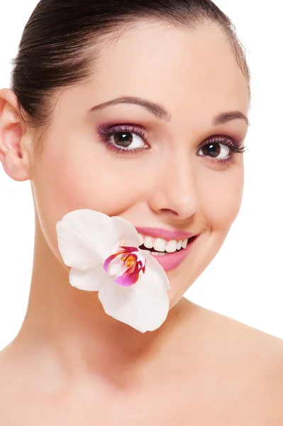 Lovely young woman with orchid — Stock Photo, Image