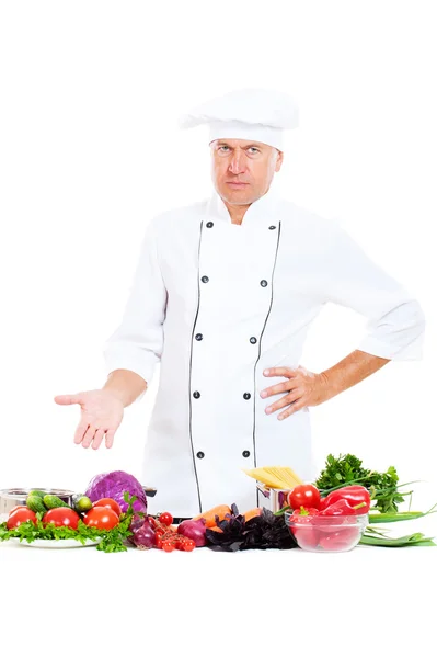 Serious chef with bright food — Stock Photo, Image