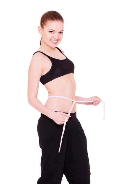 Mulher magro medindo sua cintura — Fotografia de Stock