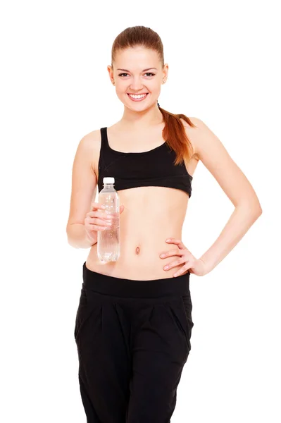 Smiley sportswoman with bottle of water — Stock Photo, Image