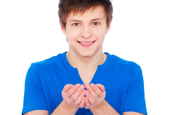 Smiley man holding something on his palm — Stock Photo, Image