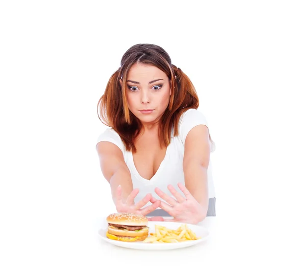 Jonge vrouw wil niet eet junkfood — Stockfoto