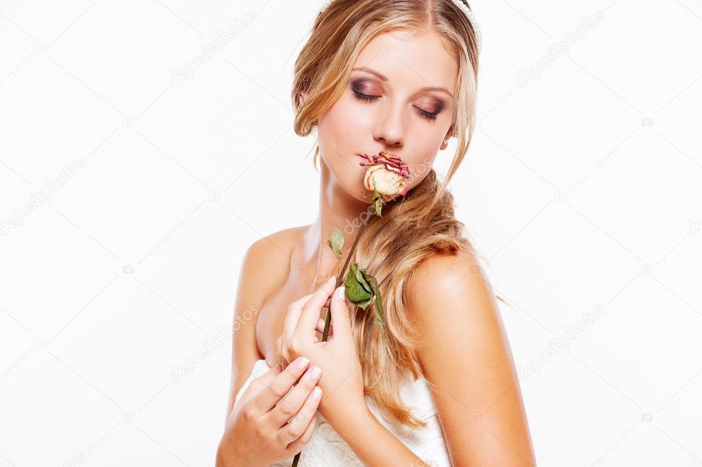 Young woman with rose on white background