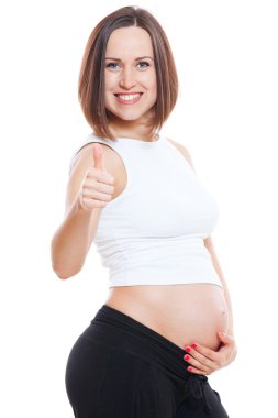 Happy pregnant woman showing thumbs up clipart