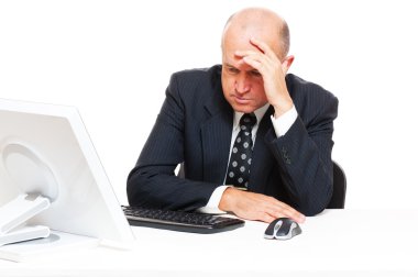 Sad businessman sitting in office clipart