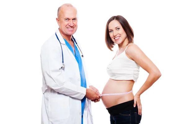 Doctor measuring stomach at pregnant woman — Stock Photo, Image