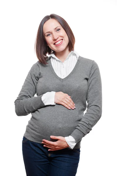 Glücklich schwangere Frau im grauen Pullover — Stockfoto