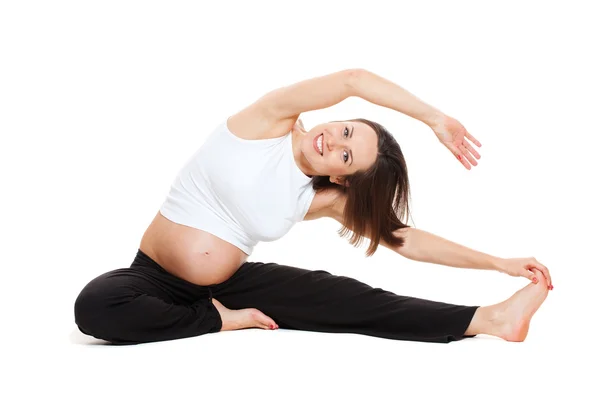 Hamile kadının jimnastik esneme yapması — Stok fotoğraf