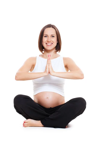 Mujer embarazada haciendo yoga meditando ejercicio —  Fotos de Stock