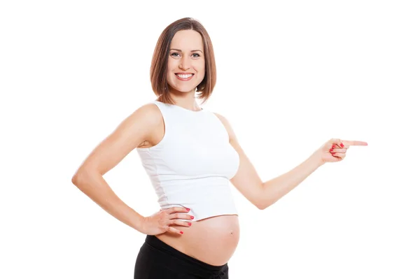 Gravid kvinna som pekar på något — Stockfoto