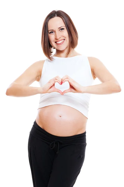 Hamile kadın parmakları kalp gibi gösterilen — Stok fotoğraf