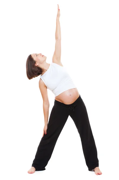 Unga gravid kvinna gör yoga — Stockfoto
