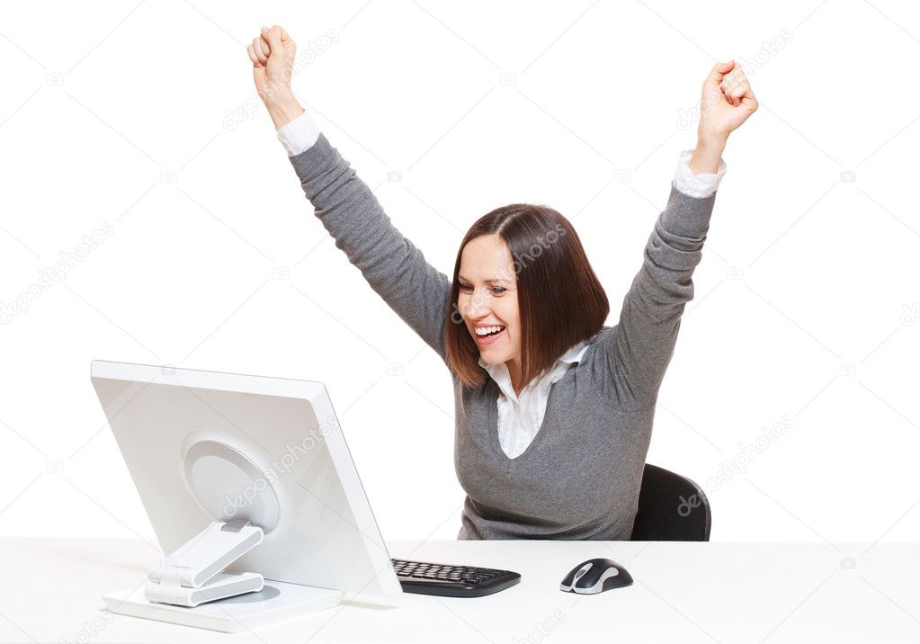 Happy businesswoman looking in monitor