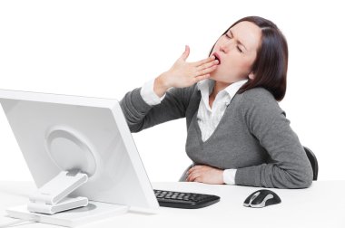 Businesswoman yawning on her workplace clipart