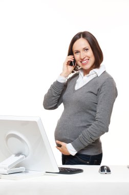 Pregnant woman talking on mobile phone clipart