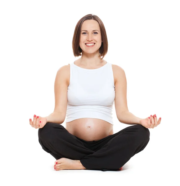 Piękna kobieta w ciąży robi joga — Zdjęcie stockowe