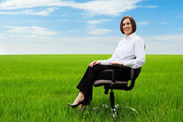 Businesswoman sitting on chair — Stock Photo, Image