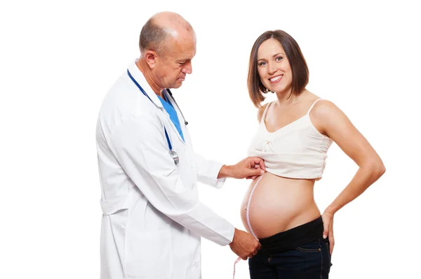 Doctor measuring stomach at pregnant woman — Stock Photo, Image