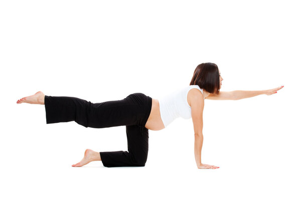 Pregnant woman doing yoga exercises