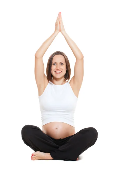 Těhotná žena dělá jógu — Stock fotografie
