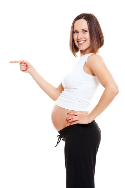 Schwangere zeigt auf etwas — Stockfoto
