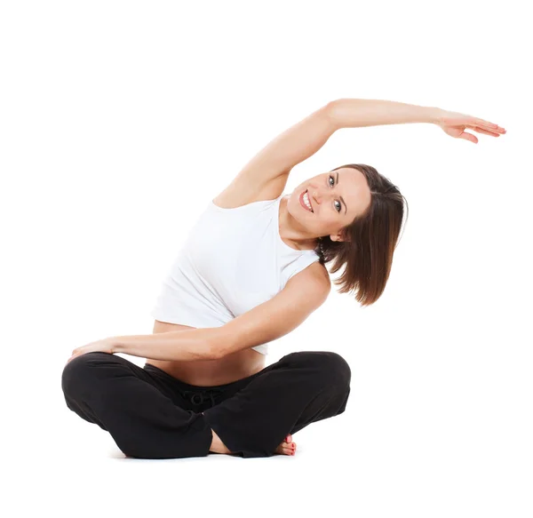Sports pregnant woman doing stretching exercise Royalty Free Stock Images