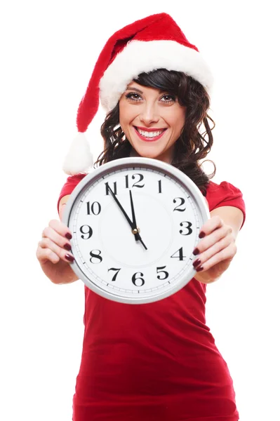 Aufgeregtes Mädchen mit Weihnachtsmütze und Uhr — Stockfoto