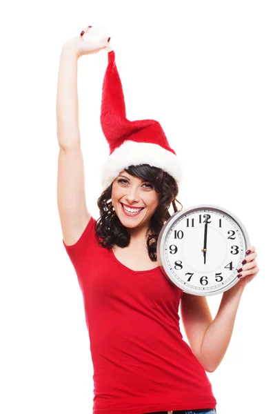 Fröhliche junge Frau mit Weihnachtsmann-Hut und Uhr — Stockfoto