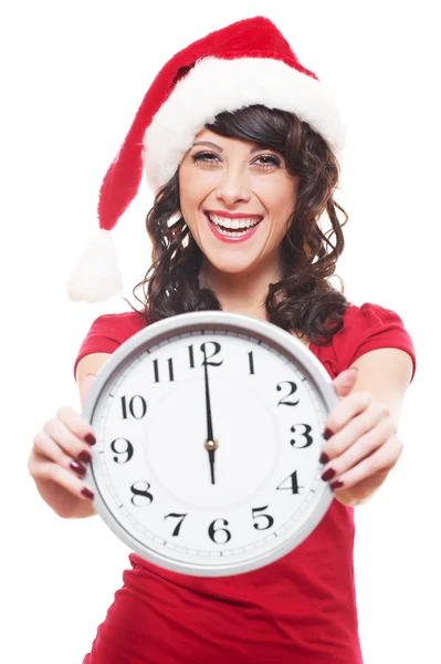 Kız saat tutan Noel Baba şapkası ile gülüyor — Stok fotoğraf