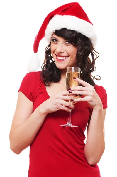 Frau mit Weihnachtsmannhut hält Glas Champagner in der Hand — Stockfoto