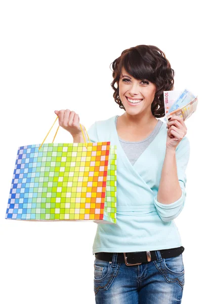 Mulher feliz segurando saco de papel e dinheiro — Fotografia de Stock