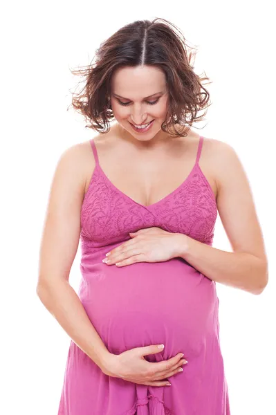 ピンクのサンドレスで妊娠中の女性 — ストック写真
