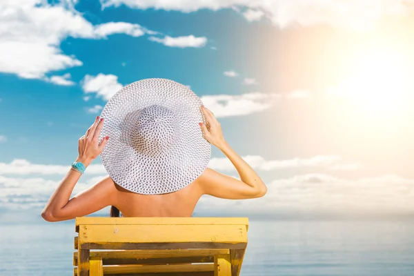 stock image Young woman relaxing on beach